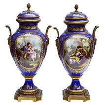 Pair 19th Century Sevres style lidded vases.