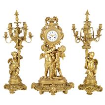 Large Louis XVI style gilded clock garniture.