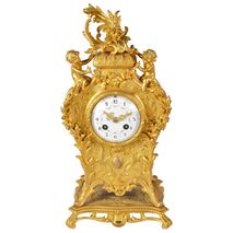 Louis XVI style gilded ormolu mantel clock with two cherubs
