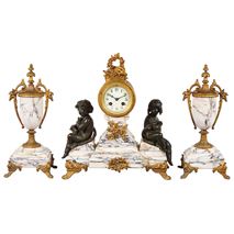 French Speltor clock set with bronzed cherubs