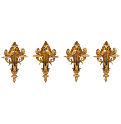 Four classical gilded bronze wall lights, 19th Century.