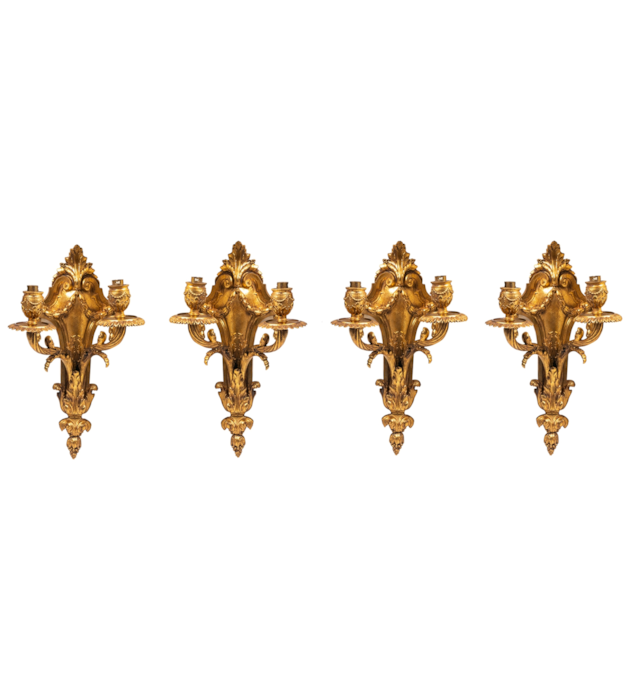 Four classical gilded bronze wall lights, 19th Century.