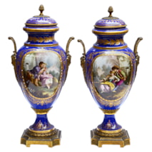 Pair 19th Century Sevres style lidded vases.