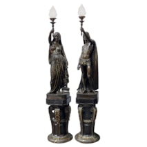 François-Christophe-Armand Toussaint (1806-1862) A large pair of French gilt + patinated bronze figural torchères