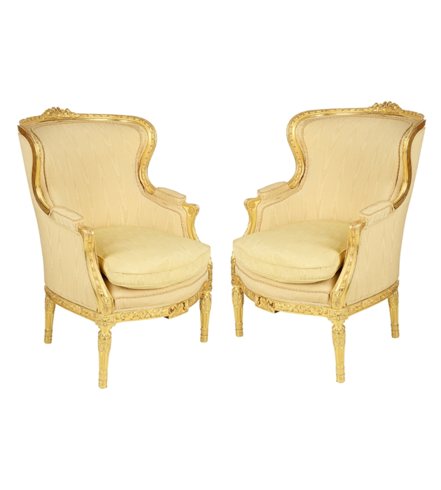 Pair Louis XVI style wing arm chairs.
