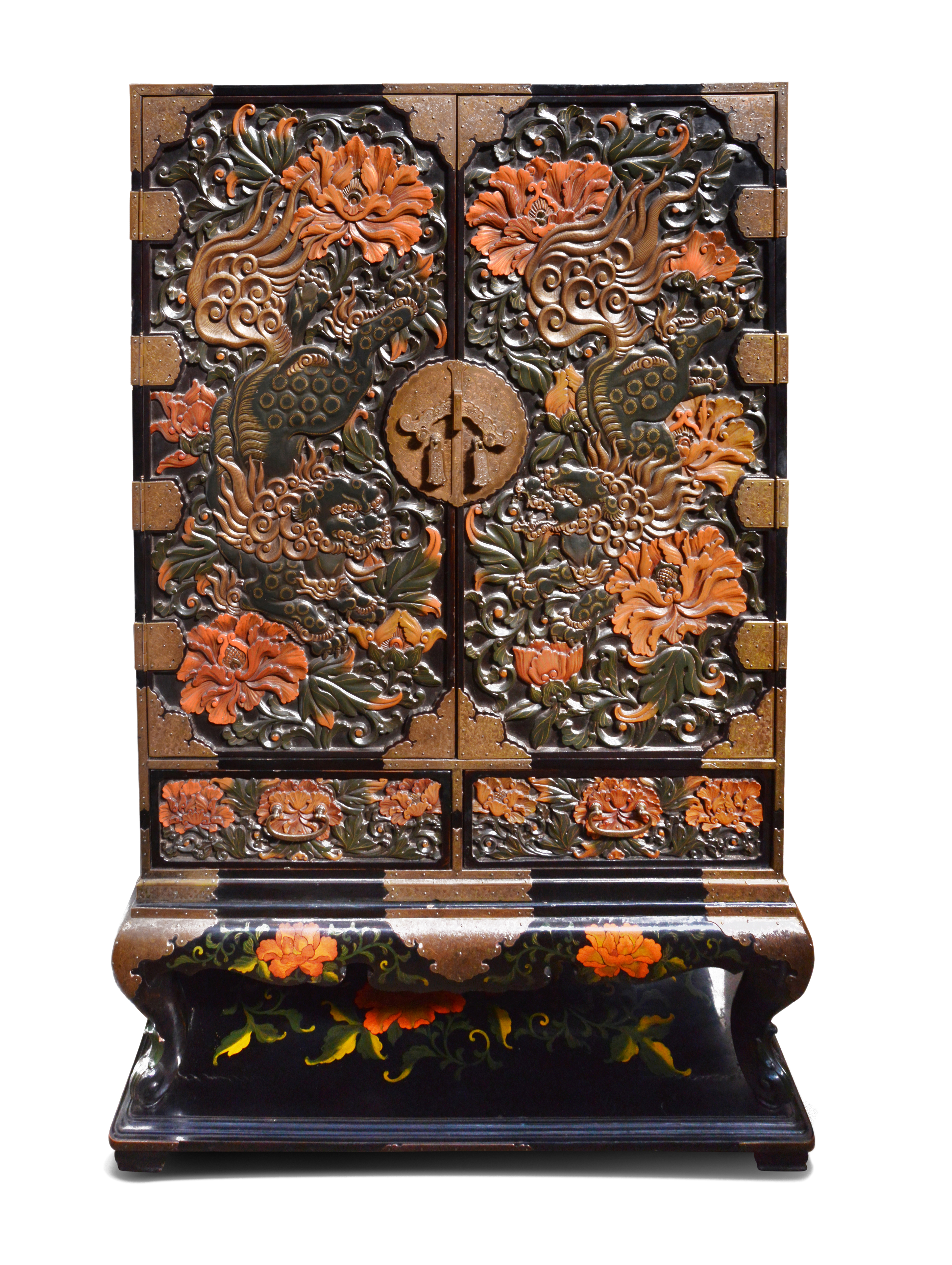Late 19th Century Chinoiserie carved Lacquer cabinet on stand.
